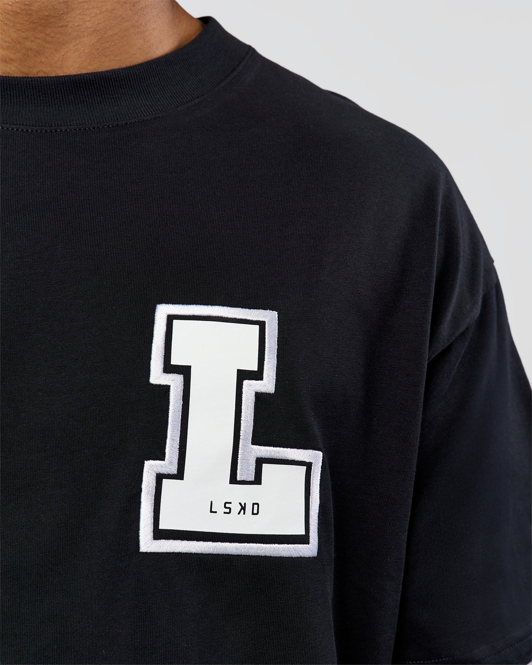 Man wearing Hype Heavyweight Unisex Oversized Tee - Black-White | Model:Xavier | Size:L - view 9