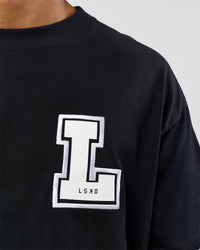 Man wearing Hype Heavyweight Unisex Oversized Tee - Black-White | Model:Xavier | Size:L | Thumbnail Index: 8