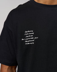 Man wearing Hype Heavyweight Unisex Oversized Tee - Black-White | Model:Xavier | Size:L | Thumbnail Index: 9