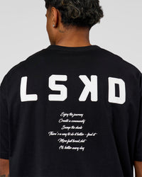 Man wearing Hype Heavyweight Unisex Oversized Tee - Black-White | Model:Xavier | Size:L | Thumbnail Index: 12