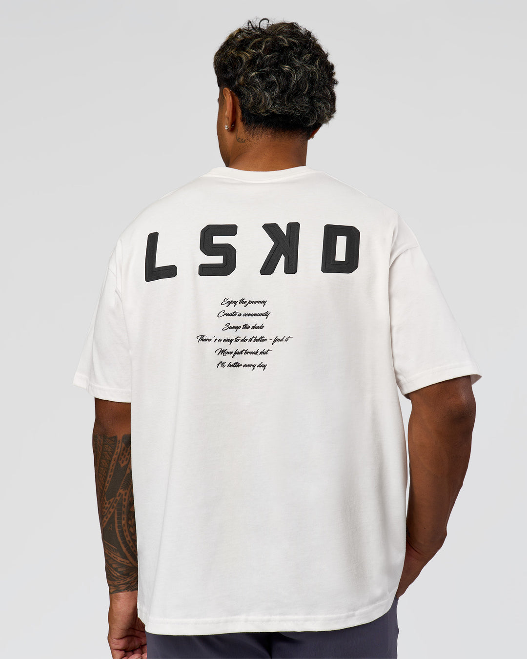 Man wearing Hype Heavyweight Unisex Oversized Tee - Off White-Black | Model:Xavier | Size:L - view 13