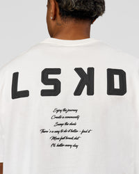 Man wearing Hype Heavyweight Unisex Oversized Tee - Off White-Black | Model:Xavier | Size:L | Thumbnail Index: 13