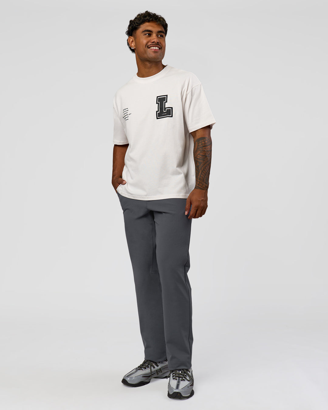 Man wearing Hype Heavyweight Unisex Oversized Tee - Off White-Black | Model:Xavier | Size:L - view 6