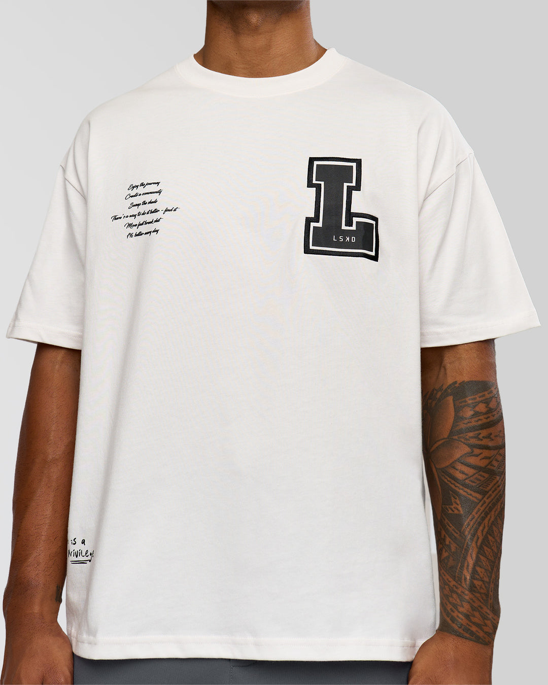 Man wearing Hype Heavyweight Unisex Oversized Tee - Off White-Black | Model:Xavier | Size:L - view 8