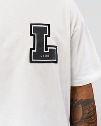 Man wearing Hype Heavyweight Unisex Oversized Tee - Off White-Black | Model:Xavier | Size:L | Thumbnail Index: 8
