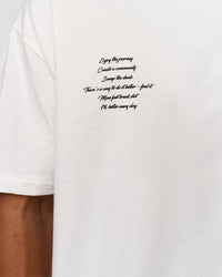 Man wearing Hype Heavyweight Unisex Oversized Tee - Off White-Black | Model:Xavier | Size:L | Thumbnail Index: 9