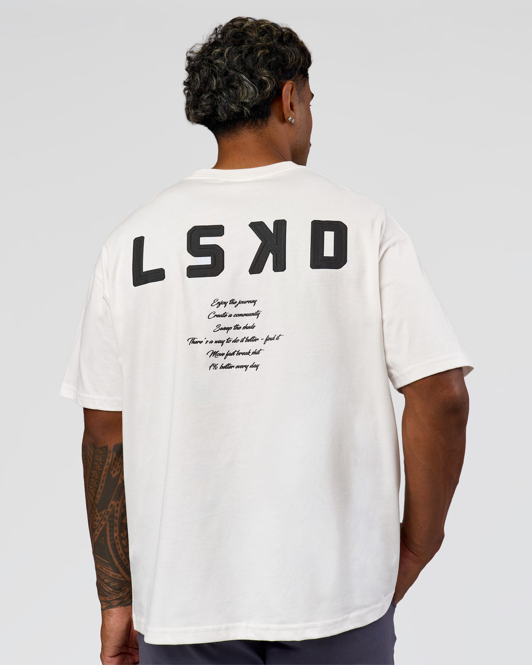 Man wearing Hype Heavyweight Unisex Oversized Tee - Off White-Black | Model:Xavier | Size:L - view 12