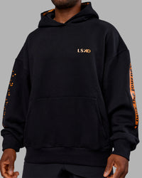 Man wearing Hyped Unisex Oversized Hoodie - Black-Vibrant Orange | Model:Sam | Size:L | Thumbnail Index: 11