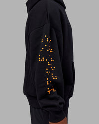 Man wearing Hyped Unisex Oversized Hoodie - Black-Vibrant Orange | Model:Sam | Size:L | Thumbnail Index: 4