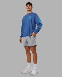 Man wearing Inferno Journey FLXCotton Oversized Long Sleeve Tee - Midnight Blue-Blue Bird | Model:Jackson | Size:L | Thumbnail Index: 10