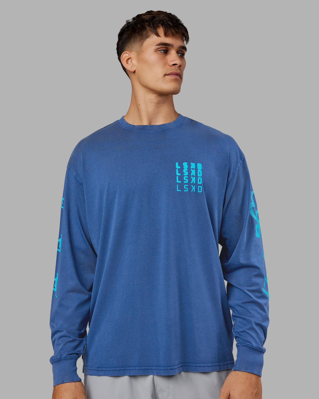 Man wearing Inferno Journey FLXCotton Oversized Long Sleeve Tee - Midnight Blue-Blue Bird | Model:Jackson | Size:L - view 7