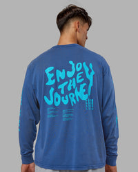 Man wearing Inferno Journey FLXCotton Oversized Long Sleeve Tee - Midnight Blue-Blue Bird | Model:Jackson | Size:L | Thumbnail Index: 2