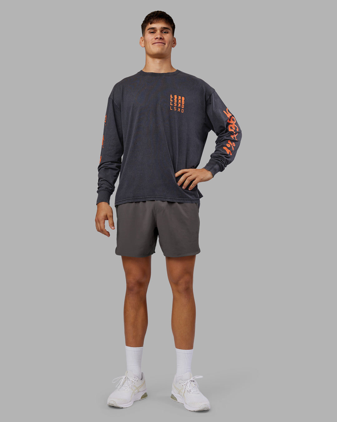 Man wearing Inferno Journey FLXCotton Oversized Long Sleeve Tee - Washed Black-Ultra Orange | Model:Jackson | Size:L - view 8