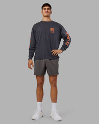 Man wearing Inferno Journey FLXCotton Oversized Long Sleeve Tee - Washed Black-Ultra Orange | Model:Jackson | Size:L | Thumbnail Index: 7