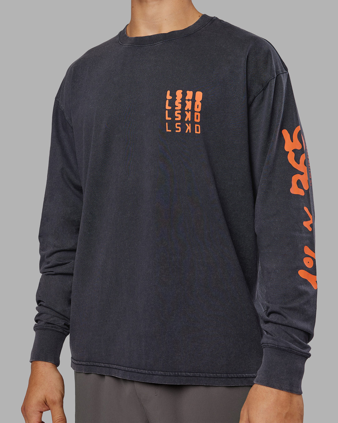 Man wearing Inferno Journey FLXCotton Oversized Long Sleeve Tee - Washed Black-Ultra Orange | Model:Jackson | Size:L - view 13