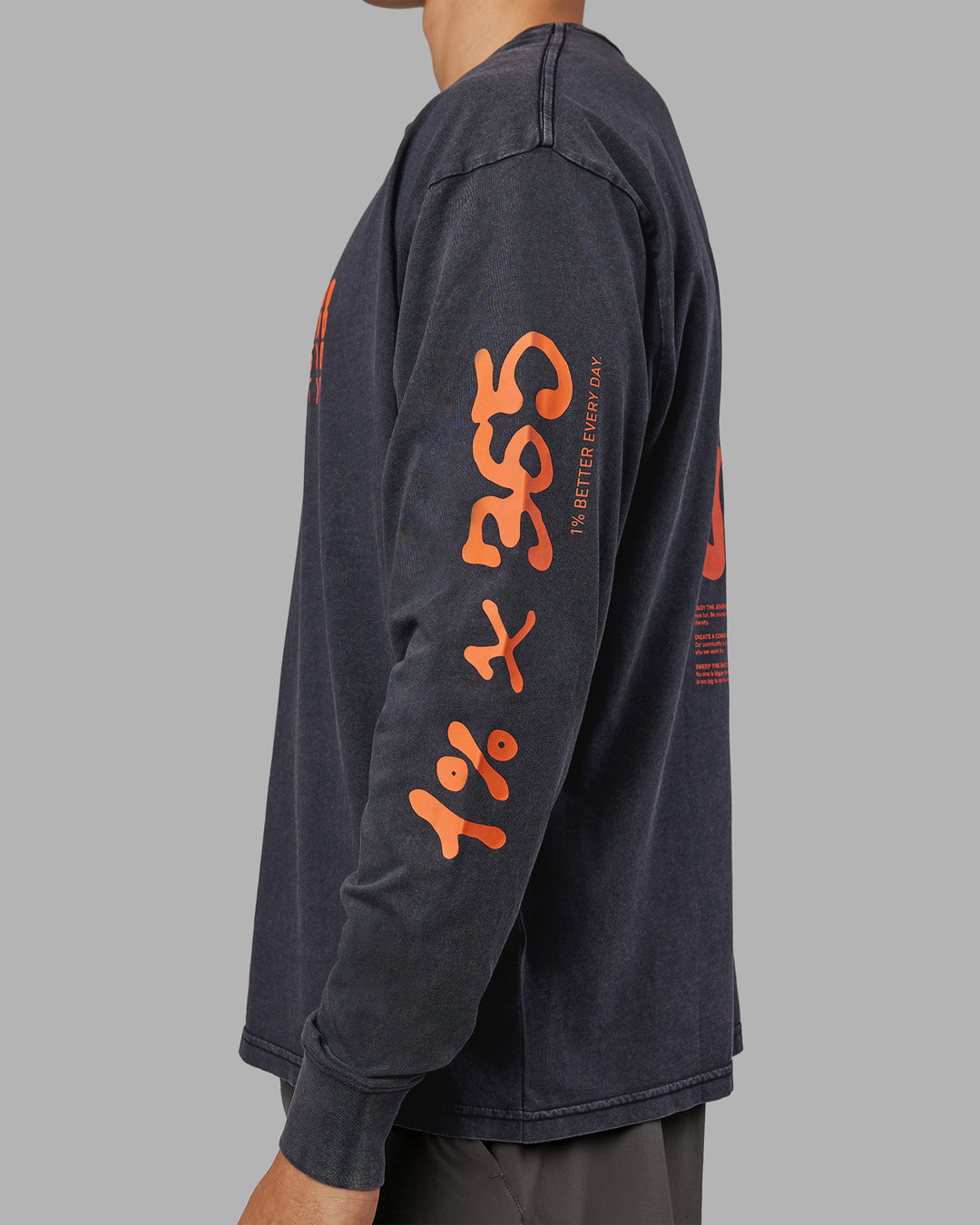 Man wearing Inferno Journey FLXCotton Oversized Long Sleeve Tee - Washed Black-Ultra Orange | Model:Jackson | Size:L - view 6