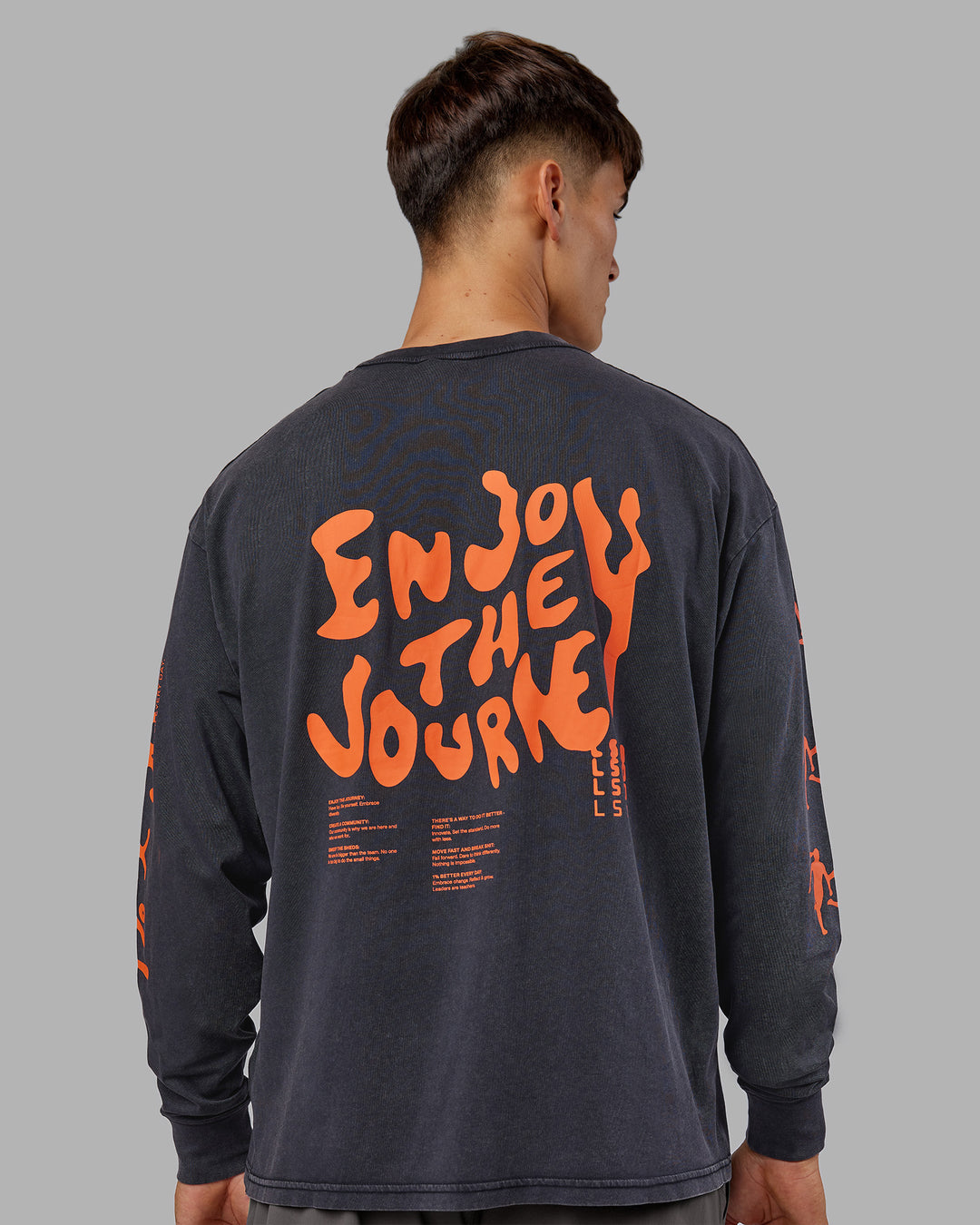 Man wearing Inferno Journey FLXCotton Oversized Long Sleeve Tee - Washed Black-Ultra Orange | Model:Jackson | Size:L - view 1