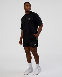 Man wearing Inferno Journey FLXCotton Oversized Tee - Black-Ultra Fuchsia | Model:Sam | Size:L | Thumbnail Index: 5