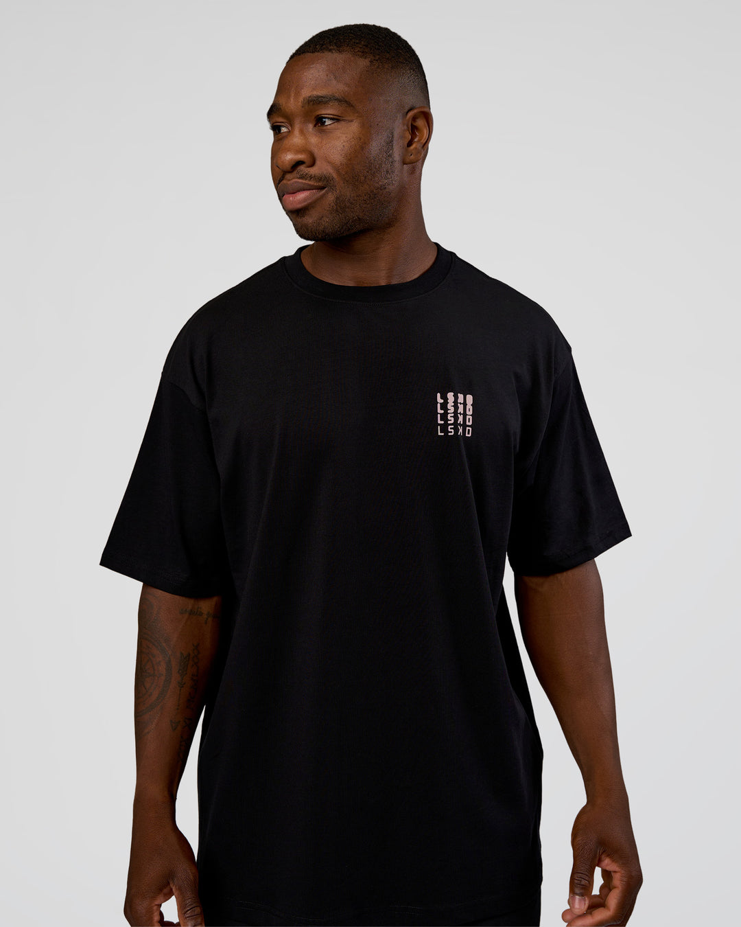 Man wearing Inferno Journey FLXCotton Oversized Tee - Black-Ultra Fuchsia | Model:Sam | Size:L - view 3