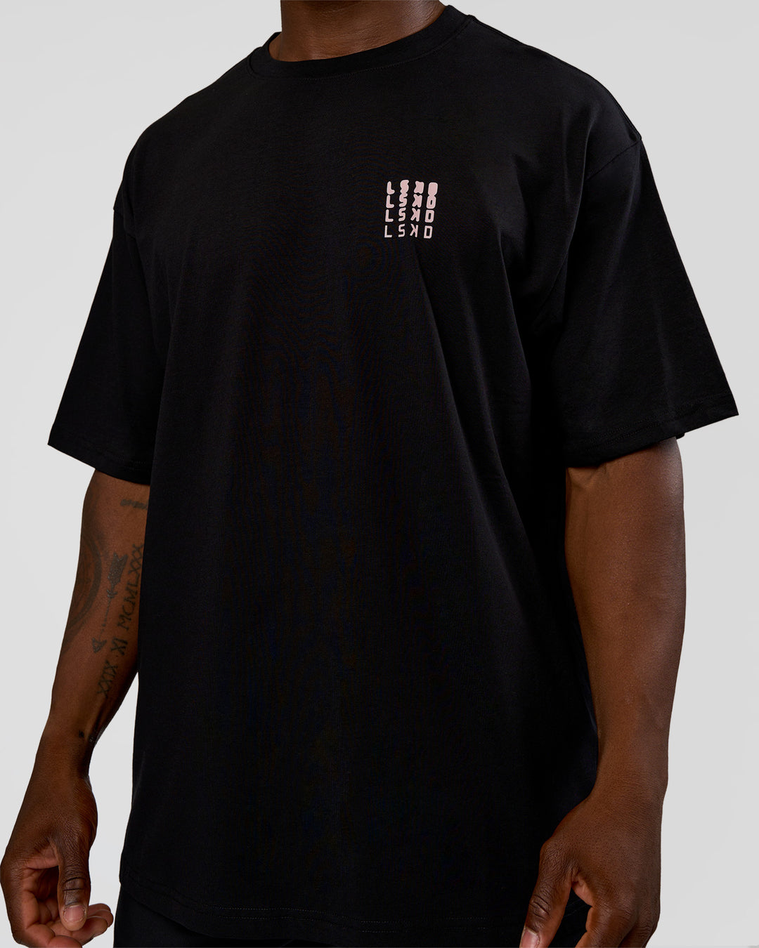 Man wearing Inferno Journey FLXCotton Oversized Tee - Black-Ultra Fuchsia | Model:Sam | Size:L - view 7