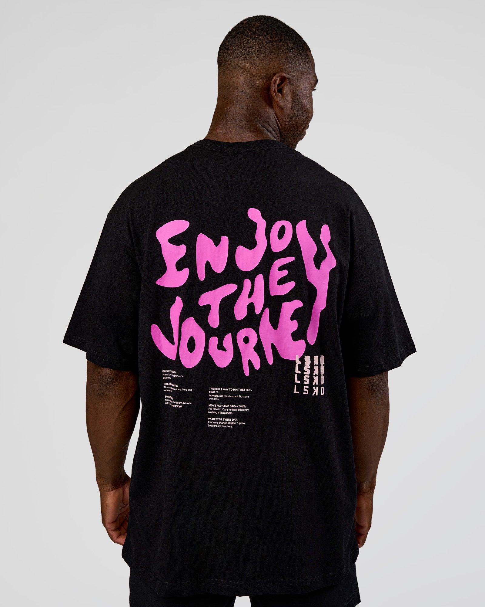 Man wearing Inferno Journey FLXCotton Oversized Tee - Black-Ultra Fuchsia | Model:Sam | Size:L