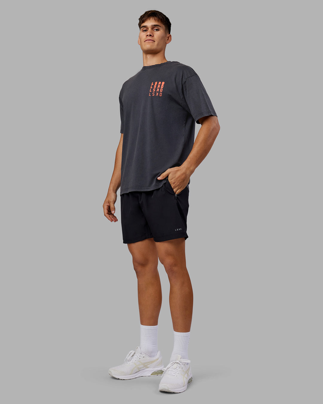 Man wearing Inferno Journey FLXCotton Oversized Tee - Black Washed-Ultra Orange | Model:Jackson | Size:L - view 6