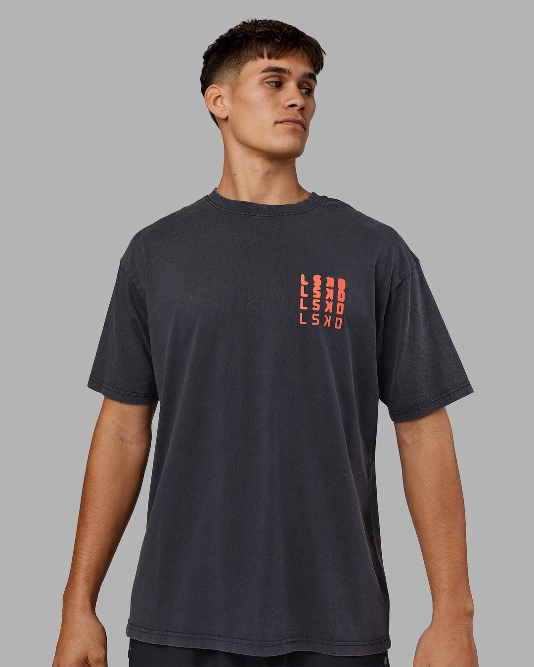 Man wearing Inferno Journey FLXCotton Oversized Tee - Black Washed-Ultra Orange | Model:Jackson | Size:L - view 4