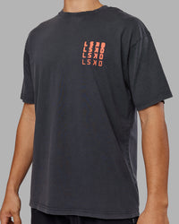 Man wearing Inferno Journey FLXCotton Oversized Tee - Black Washed-Ultra Orange | Model:Jackson | Size:L | Thumbnail Index: 8