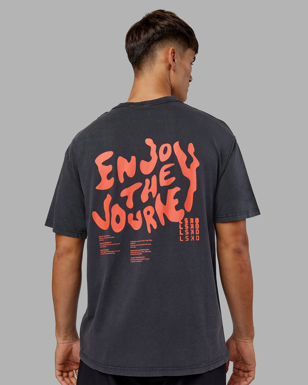 Man wearing Inferno Journey FLXCotton Oversized Tee - Black Washed-Ultra Orange | Model:Jackson | Size:L - view 10