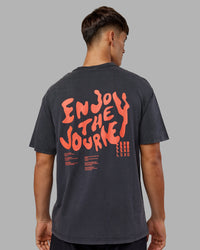 Man wearing Inferno Journey FLXCotton Oversized Tee - Black Washed-Ultra Orange | Model:Jackson | Size:L | Thumbnail Index: 9