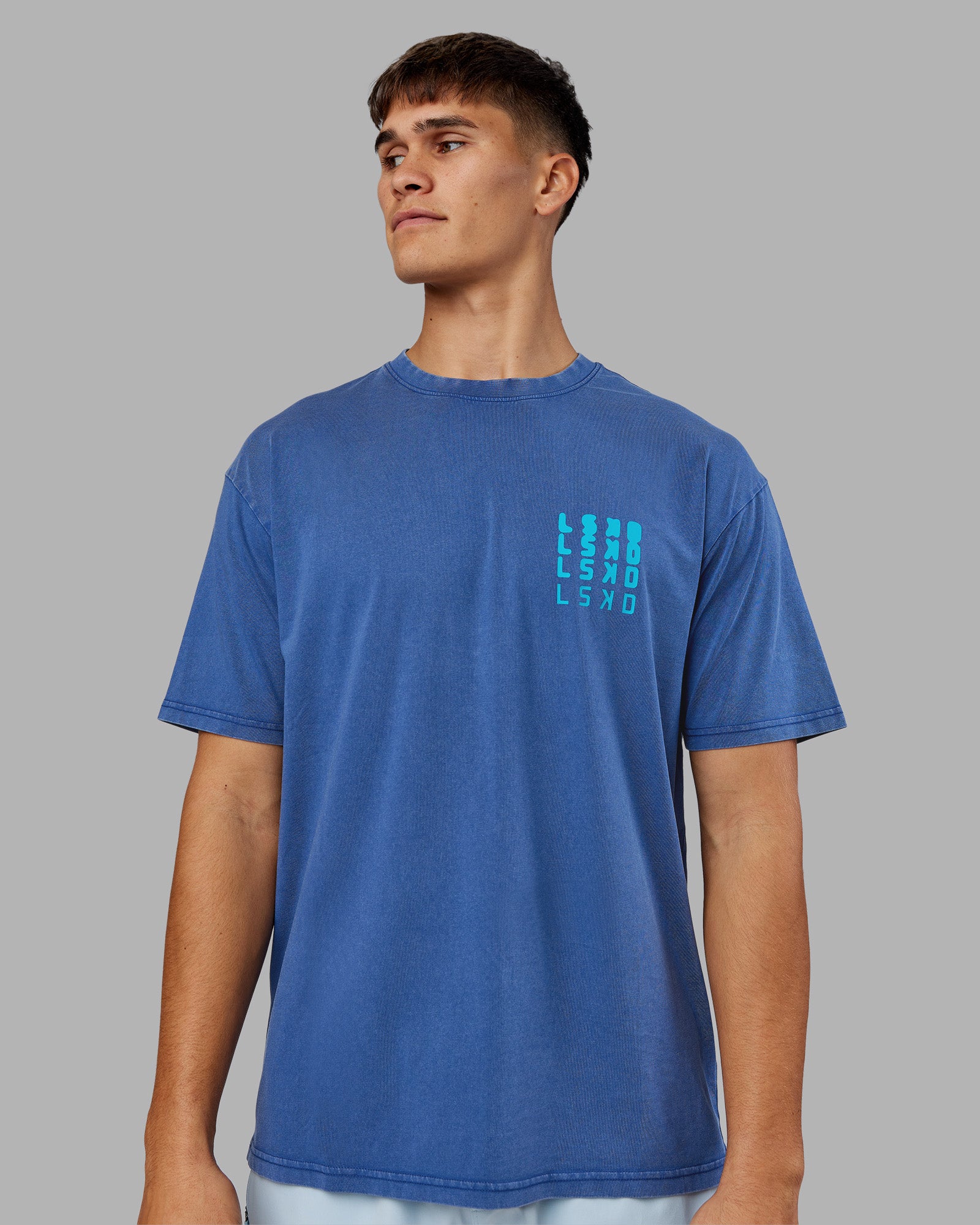Man wearing Inferno Journey FLXCotton Oversized Tee - Midnight Blue Washed-Blue | Model:Jackson | Size:L