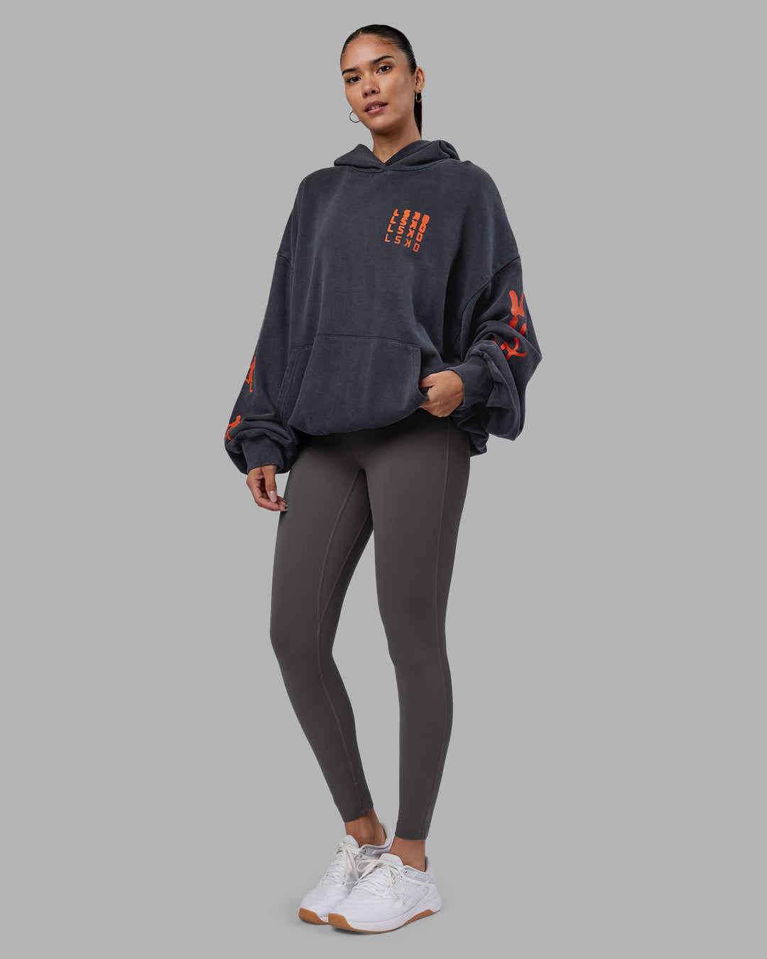 Woman wearing Journey Washed Unisex Oversize Hoodie - Black-Ultra Orange | Model:Rhiley | Size:L - view 6