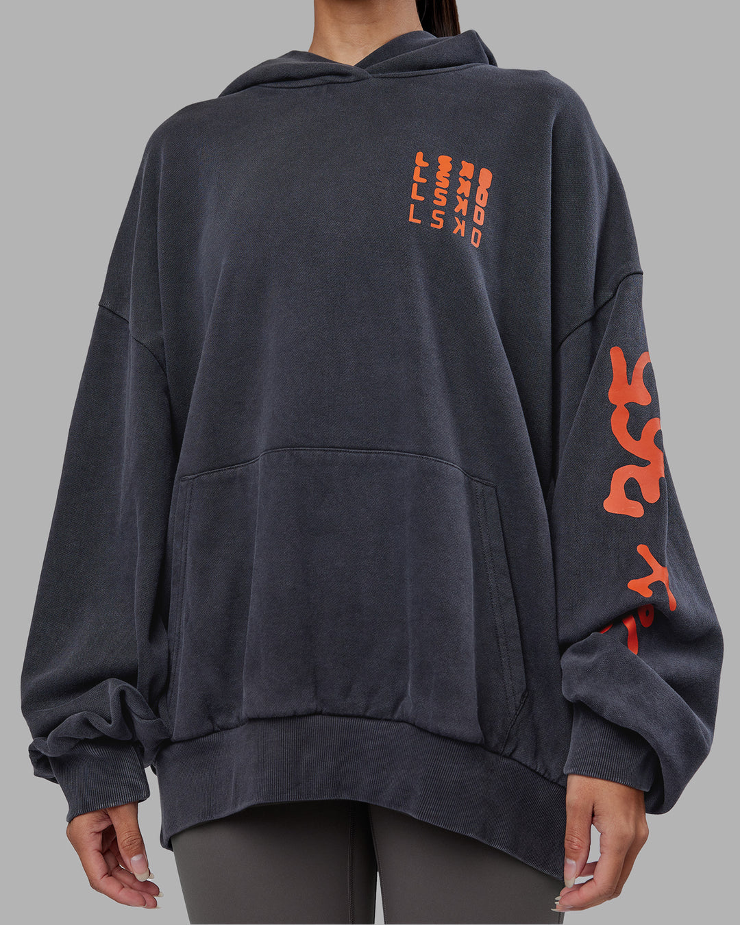 Woman wearing Journey Washed Unisex Oversize Hoodie - Black-Ultra Orange | Model:Rhiley | Size:L - view 12