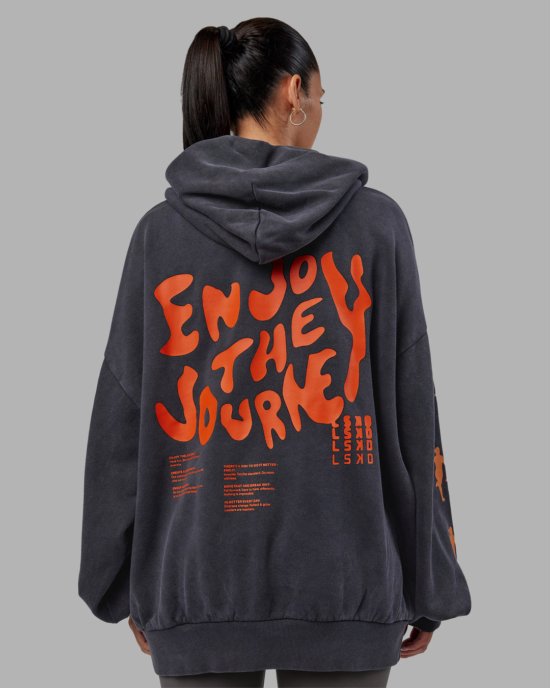 Woman wearing Journey Washed Unisex Oversize Hoodie - Black-Ultra Orange | Model:Rhiley | Size:L - view 11