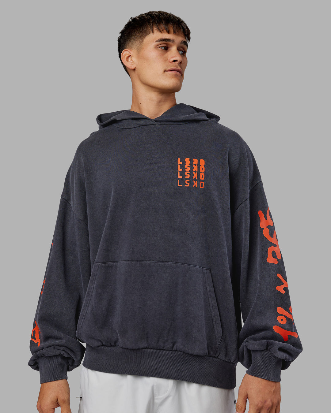 Man wearing Journey Washed Unisex Oversize Hoodie - Black-Ultra Orange | Model:Jackson | Size:L - view 5
