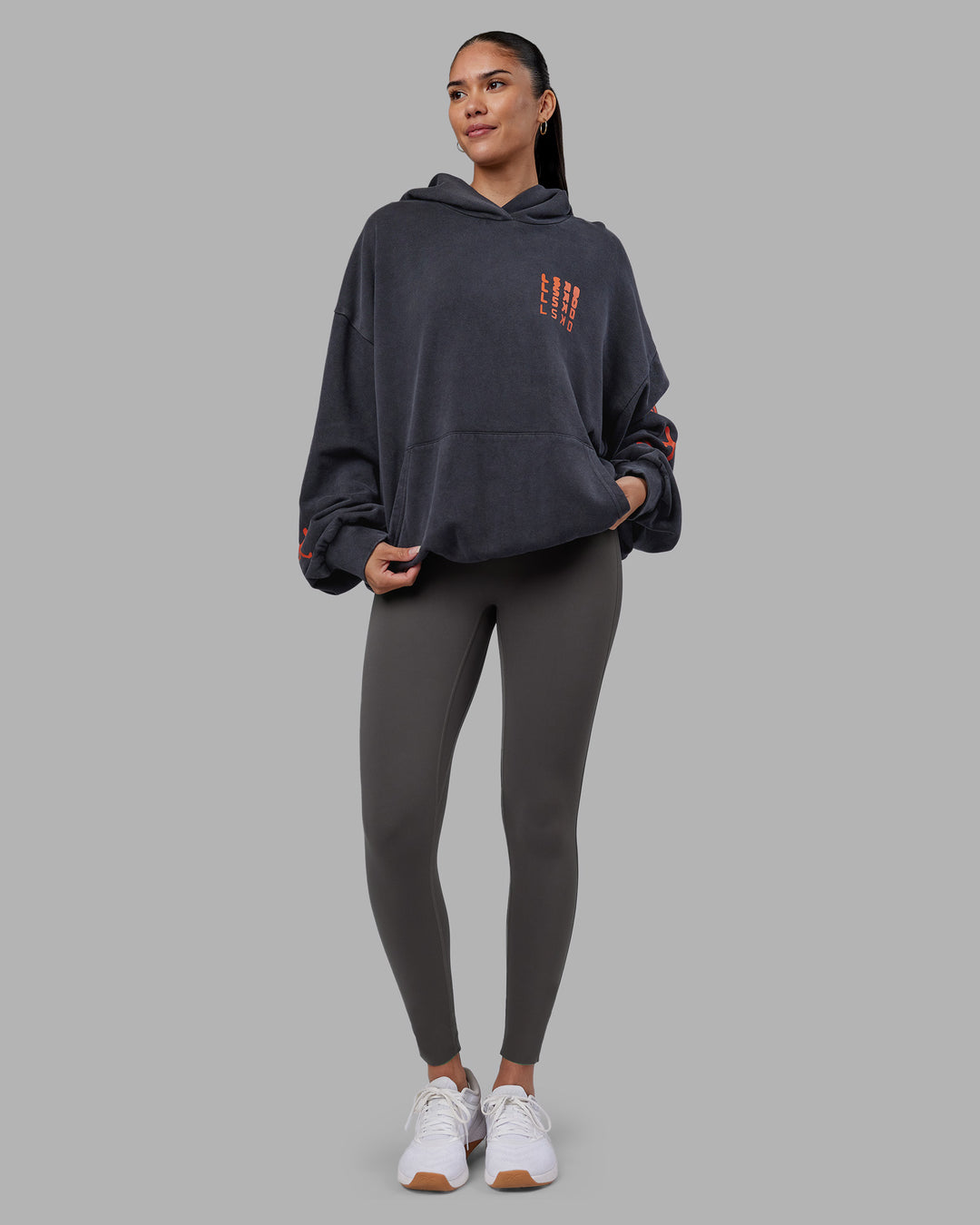 Woman wearing Journey Washed Unisex Oversize Hoodie - Black-Ultra Orange | Model:Rhiley | Size:L - view 10