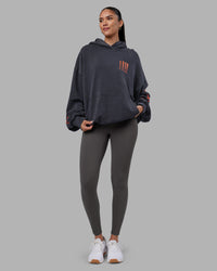 Woman wearing Journey Washed Unisex Oversize Hoodie - Black-Ultra Orange | Model:Rhiley | Size:L | Thumbnail Index: 9