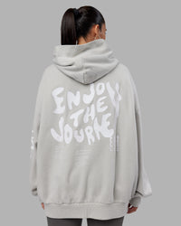 Woman wearing Journey Washed Unisex Oversize Hoodie - Digital Mist-White | Model:Rhiley | Size:L | Thumbnail Index: 1