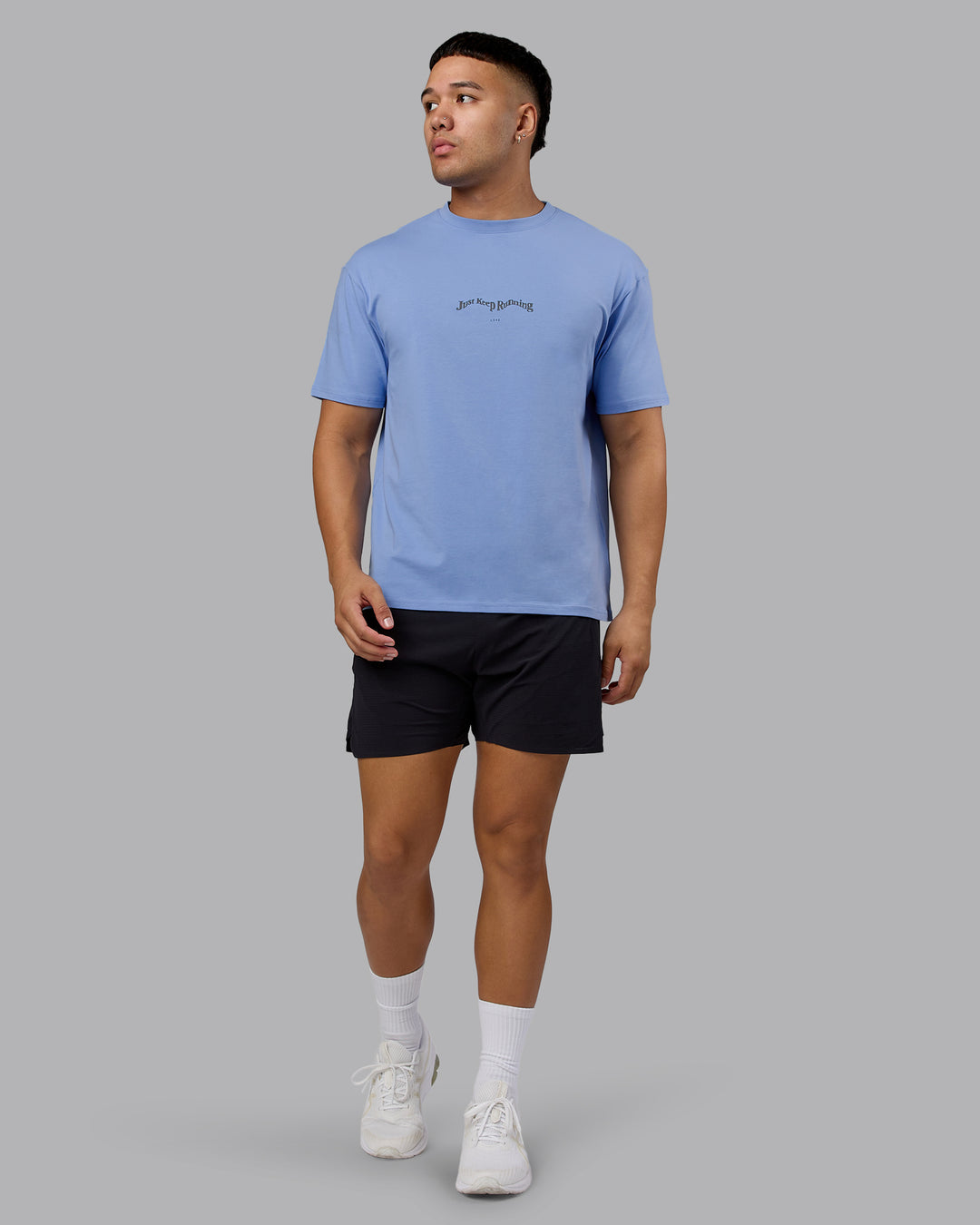Man wearing Just Run FLXCotton Oversized Tee - Soft Blue-Dark Storm | Model:Kaelyb | Size:L - view 6
