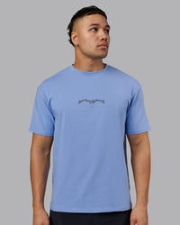 Man wearing Just Run FLXCotton Oversized Tee - Soft Blue-Dark Storm | Model:Kaelyb | Size:L | Thumbnail Index: 1