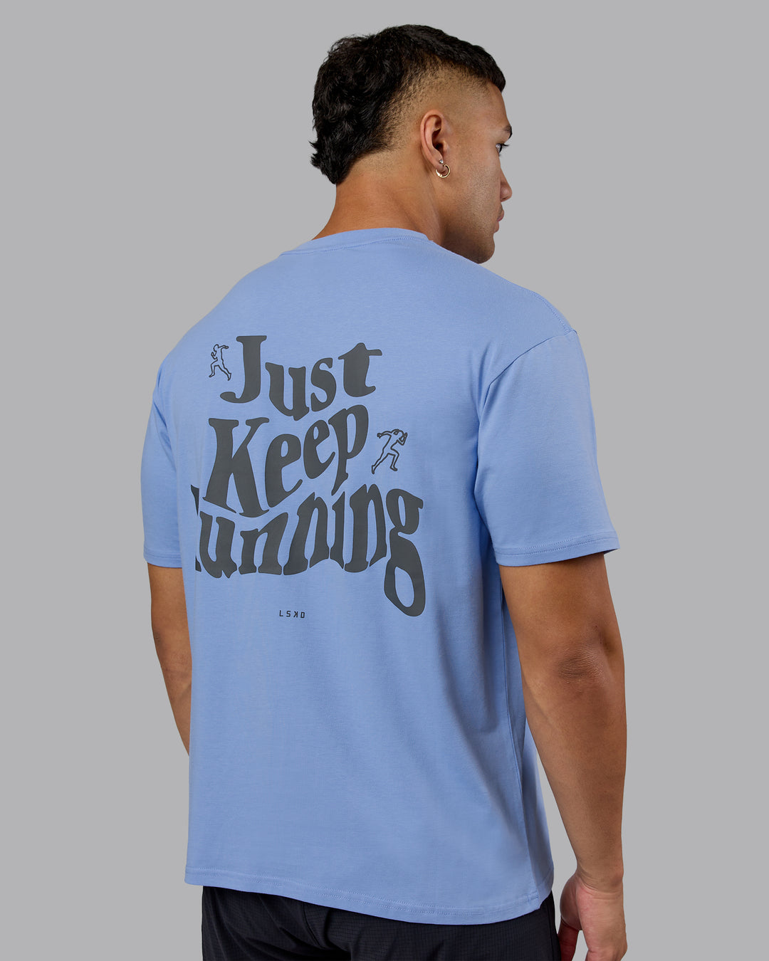 Man wearing Just Run FLXCotton Oversized Tee - Soft Blue-Dark Storm | Model:Kaelyb | Size:L - view 8