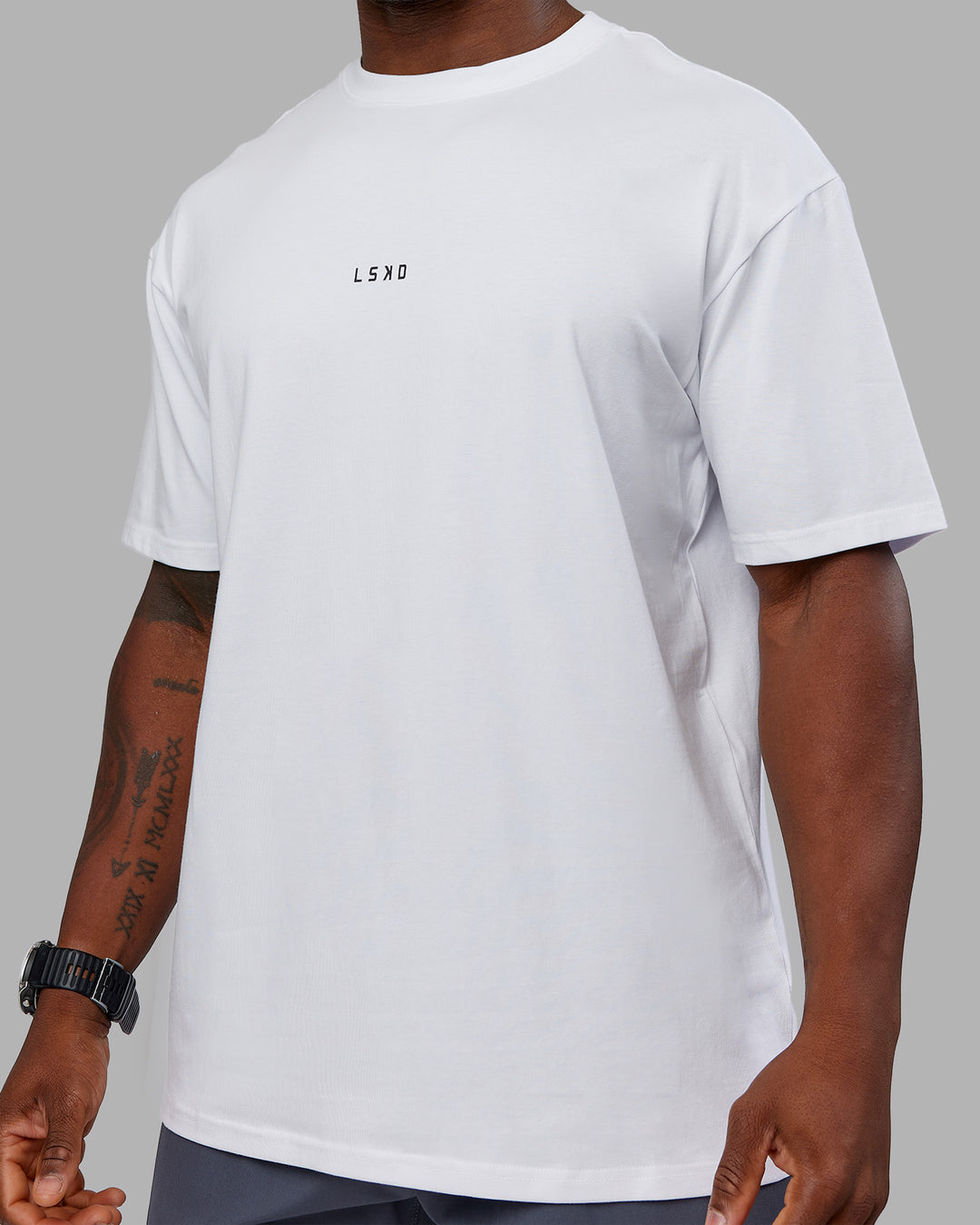 Man wearing Kettlebell FLXCotton Oversized Tee - White-Black | Model:Sam | Size:L - view 10