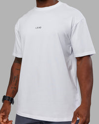 Man wearing Kettlebell FLXCotton Oversized Tee - White-Black | Model:Sam | Size:L | Thumbnail Index: 9