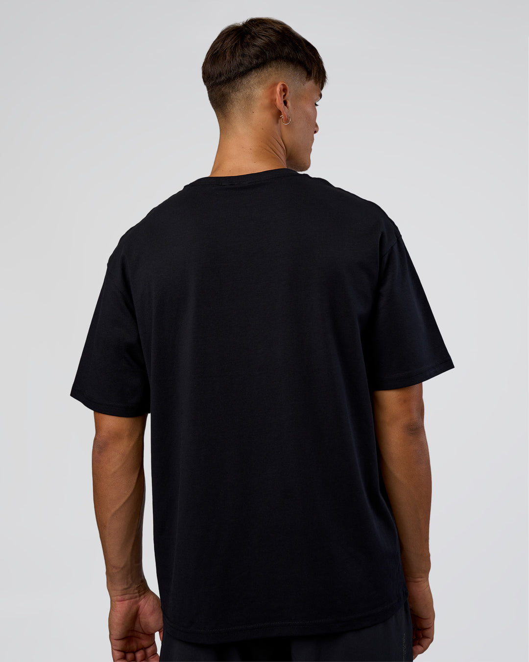 Man wearing LSKD Run Club FLXCotton Oversized Tee - Black-White | Model:Jackson | Size:L - view 7