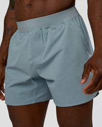Man wearing Lift 6" Short - Dusty Blue | Model:Sam | Size:L | Thumbnail Index: 1