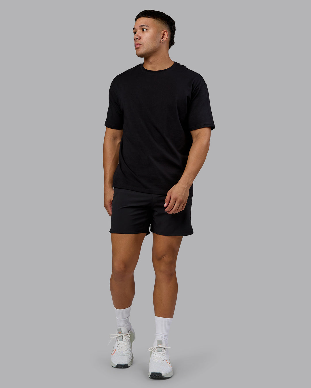 Man wearing Lifting Club FLXCotton Tee Oversize - Black-Ultra Orange | Model:Kaelyb | Size:L - view 5