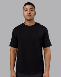 Man wearing Lifting Club FLXCotton Tee Oversize - Black-Ultra Orange | Model:Kaelyb | Size:L | Thumbnail Index: 2