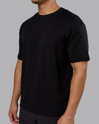 Man wearing Lifting Club FLXCotton Tee Oversize - Black-Ultra Orange | Model:Kaelyb | Size:L | Thumbnail Index: 7