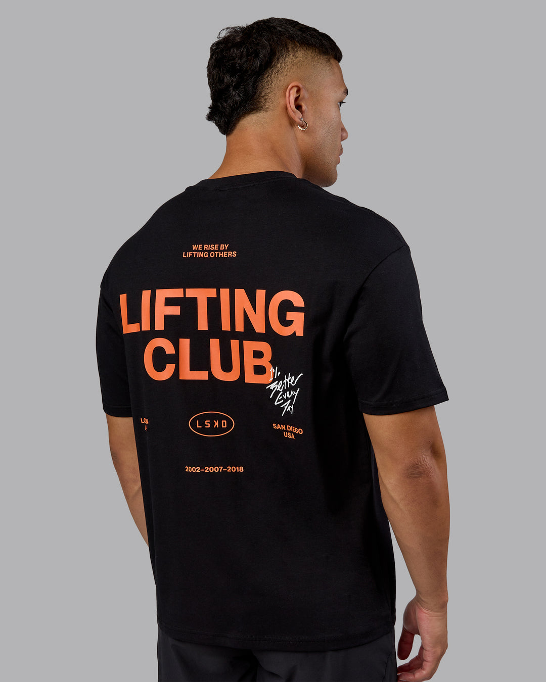 Man wearing Lifting Club FLXCotton Tee Oversize - Black-Ultra Orange | Model:Kaelyb | Size:L - view 7
