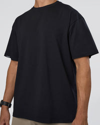 Man wearing Lifting Club FLXCotton Tee Oversize - Black-Black | Model:Nikola | Size:L | Thumbnail Index: 7